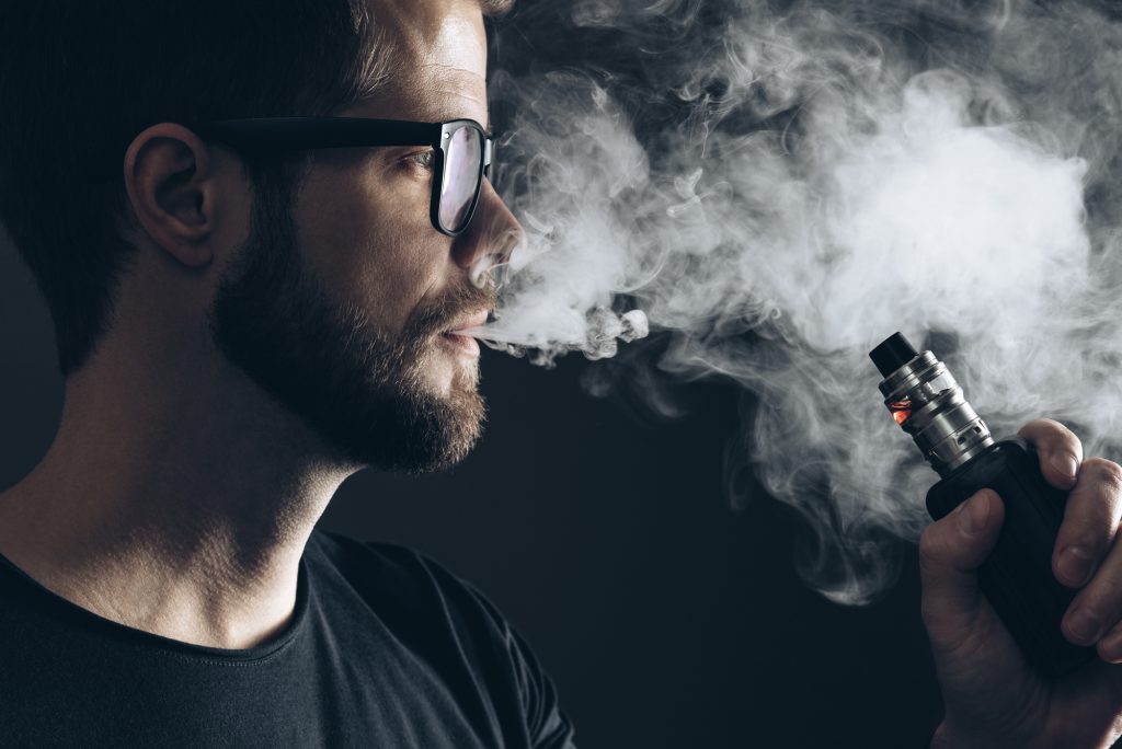 Vaping flavored e-liquid from an electronic cigarette